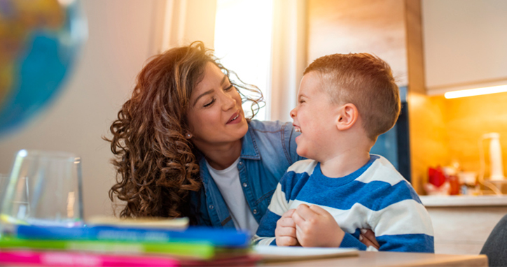 Kid smiling with teacher