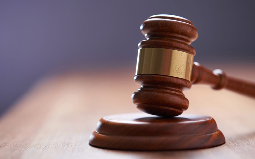 Selective focus on gavel hammer on wooden table top