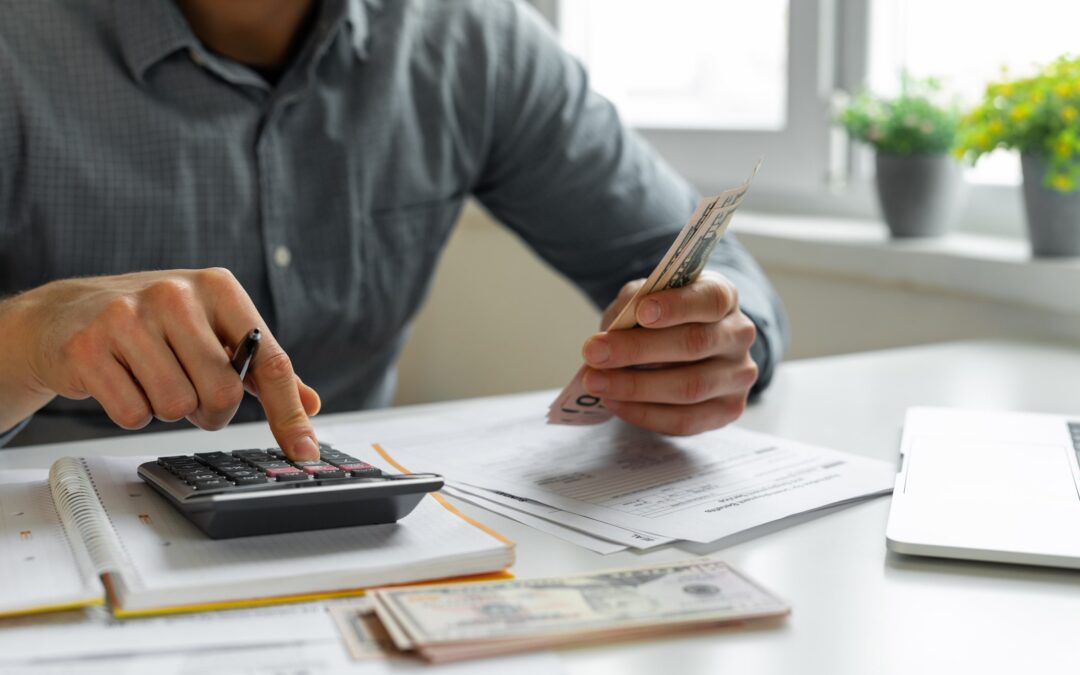 Man using calculator